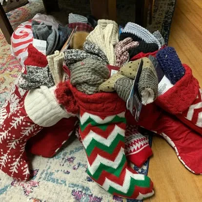 Holiday stockings full of hats and gloves
